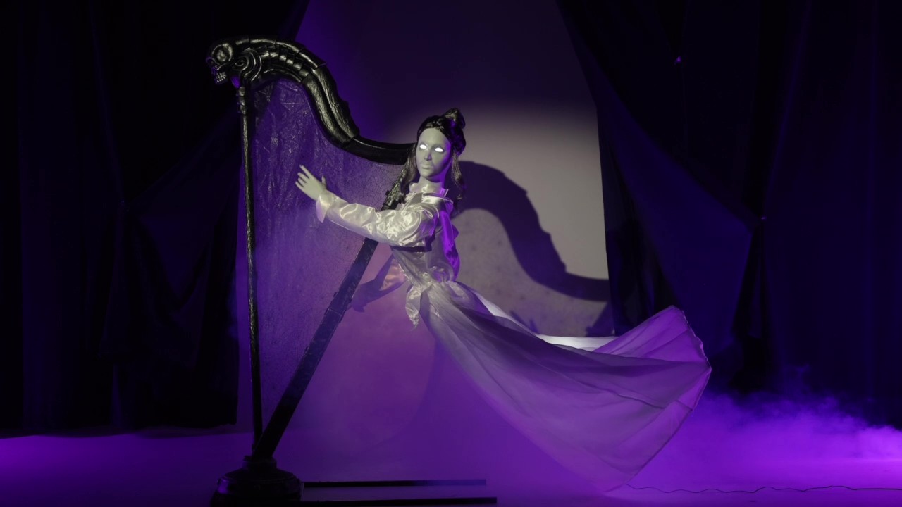 Add a touch of haunted harmony to your décor with Celeste the Restless Ghost. Standing at 5.5 feet tall, this animatronic ghost plays her harp with unsettling grace, her face lighting up as haunting music echoes through the night. A ghostly centerpiece that’s as enchanting as it is eerie.